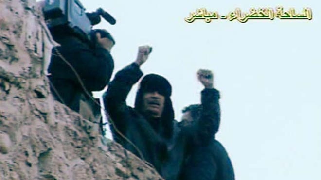 Qaddafi on the run.jpg